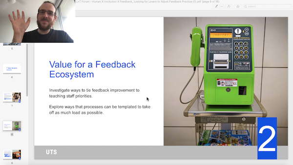 A slide showing the title 'value for a feedback ecosystem', a picture of a green phone, and a window with the video feed featuring Marty. 