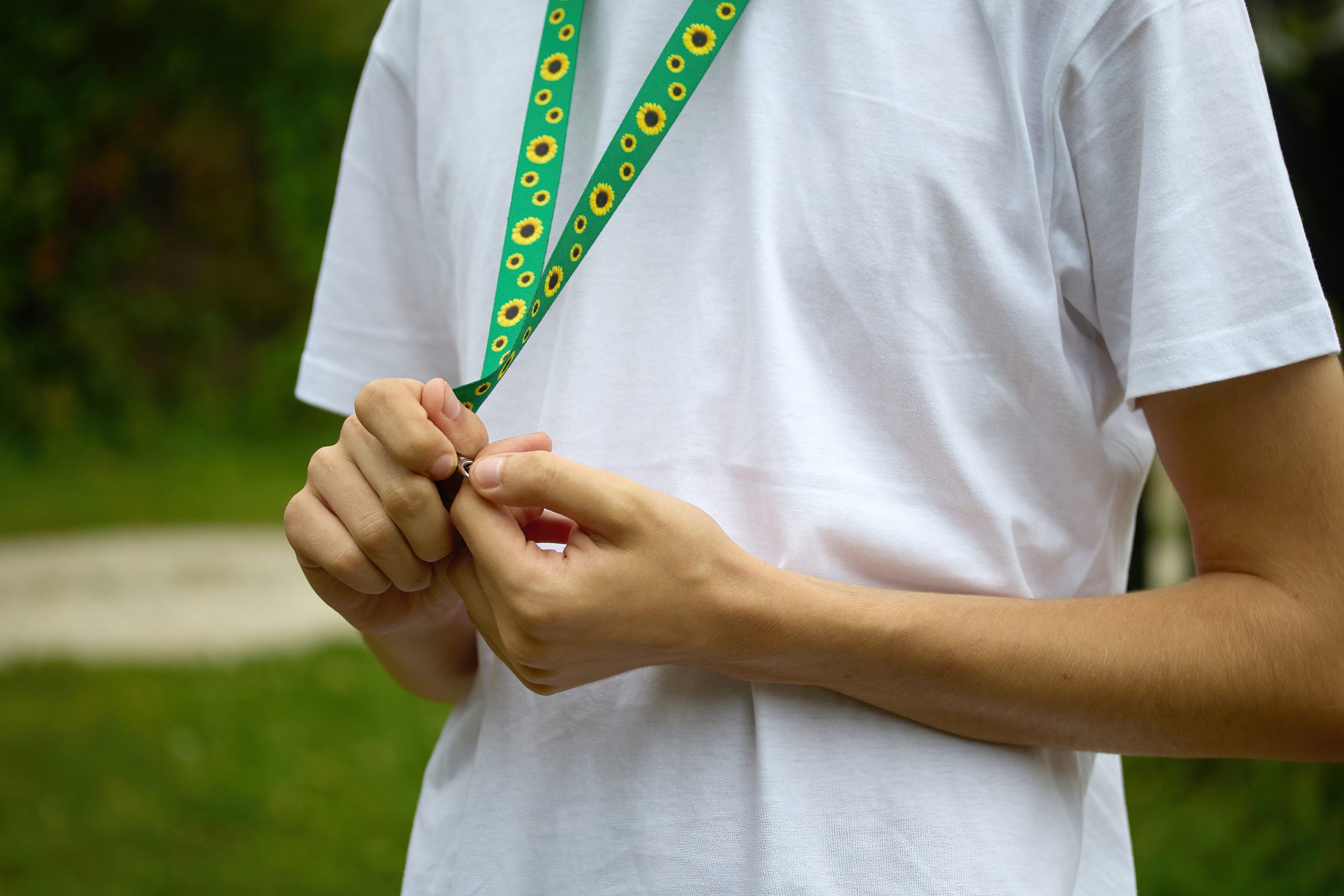 Student wearing a sunflower lanyard