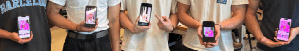 5 phones featuring pink cat images held up by students